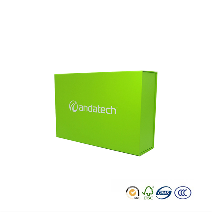 green paper box with silver LOGO