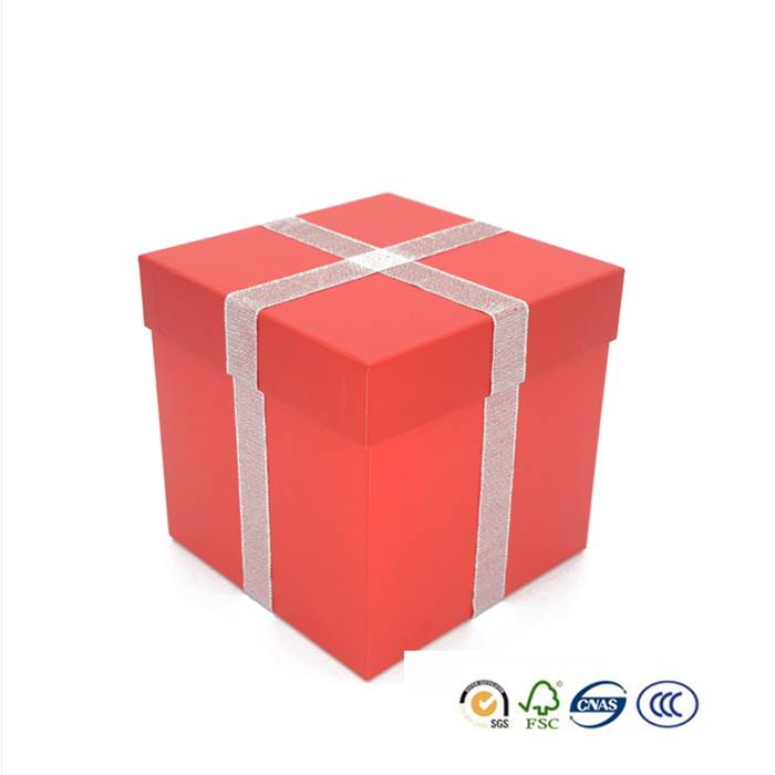 Christmas gift box with ribbon glued