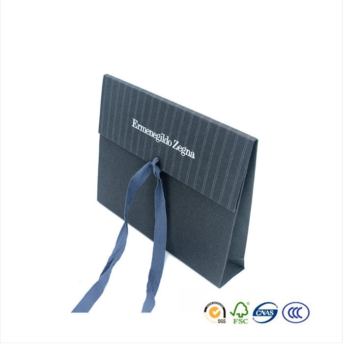 paper bag with flap and ribbon closure